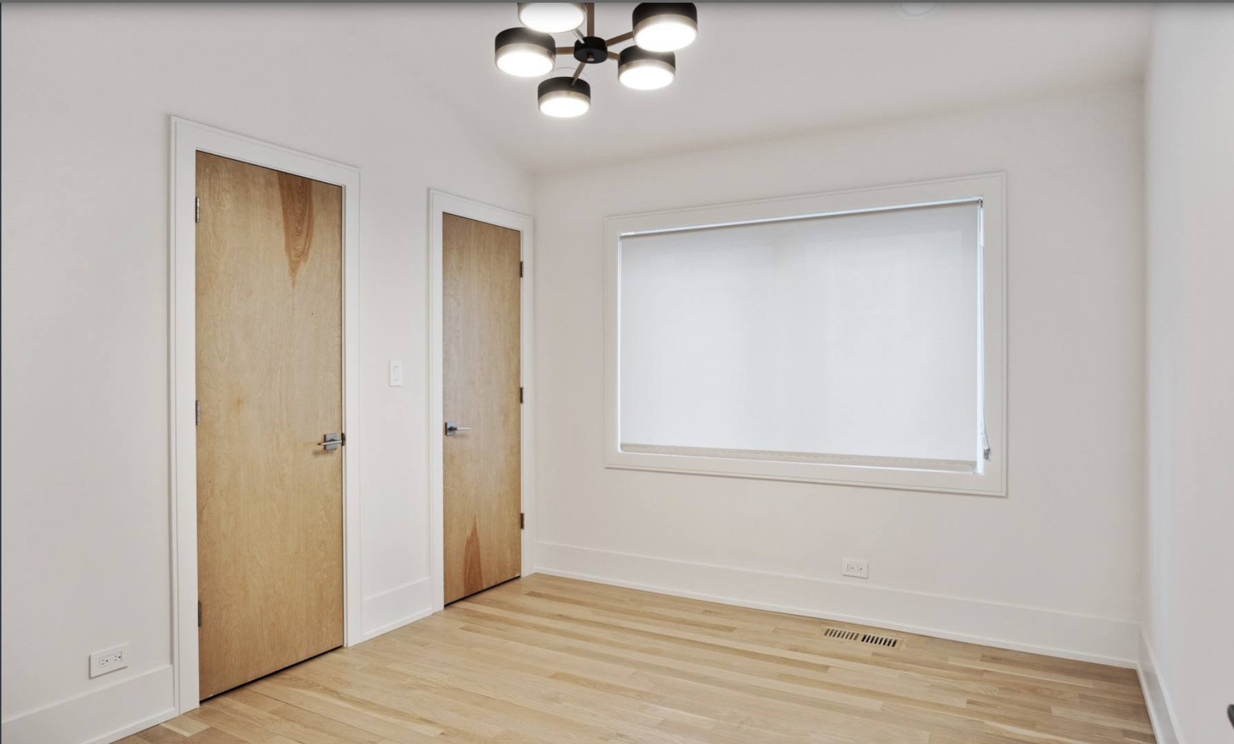 548 Exmoor Road Kenilworth, IL 60043 - Photo 14 of 19 a view of an empty room with wooden floor and a window
