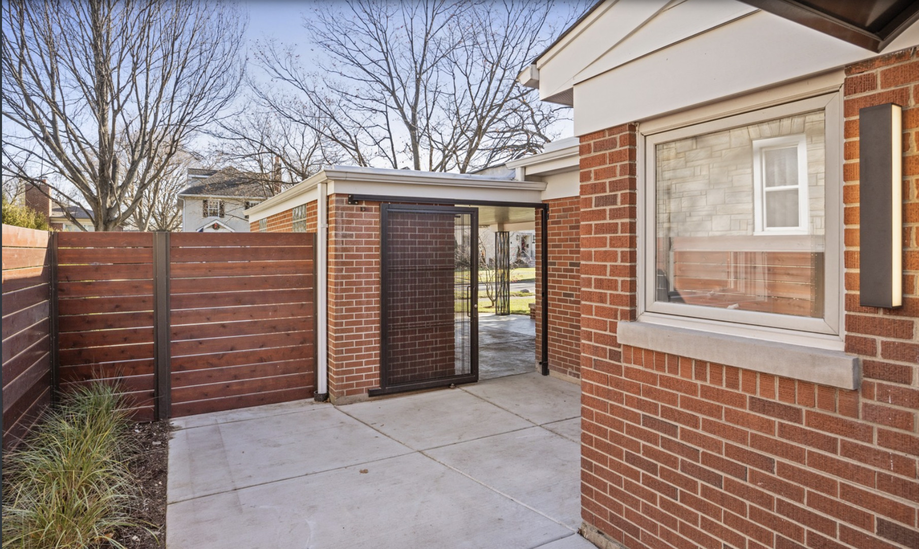 548 Exmoor Road Kenilworth, IL 60043 - Photo 18 of 19 a view of a house with a backyard and wooden fence