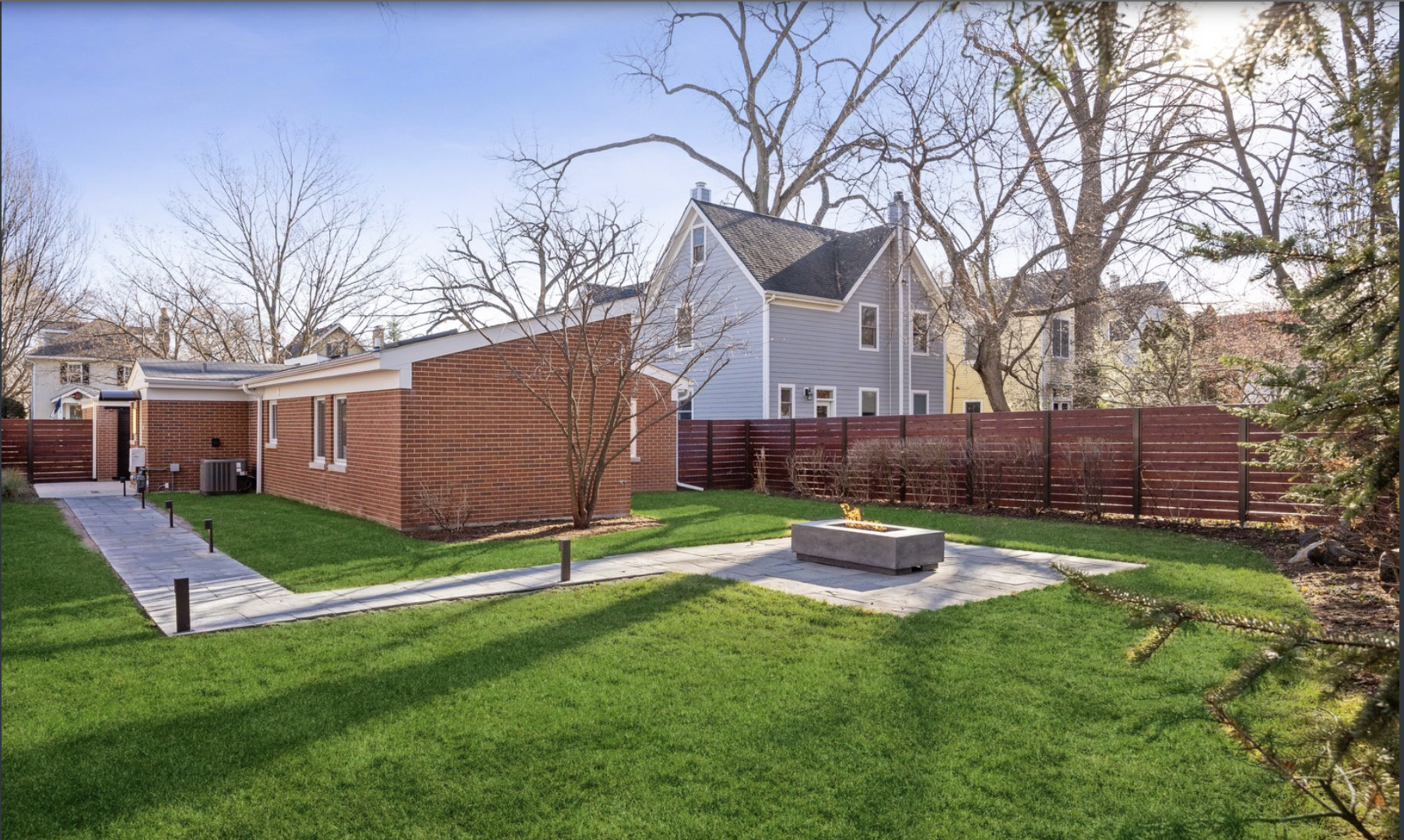548 Exmoor Road Kenilworth, IL 60043 - Photo 2 of 19 a front view of a house with a garden and yard