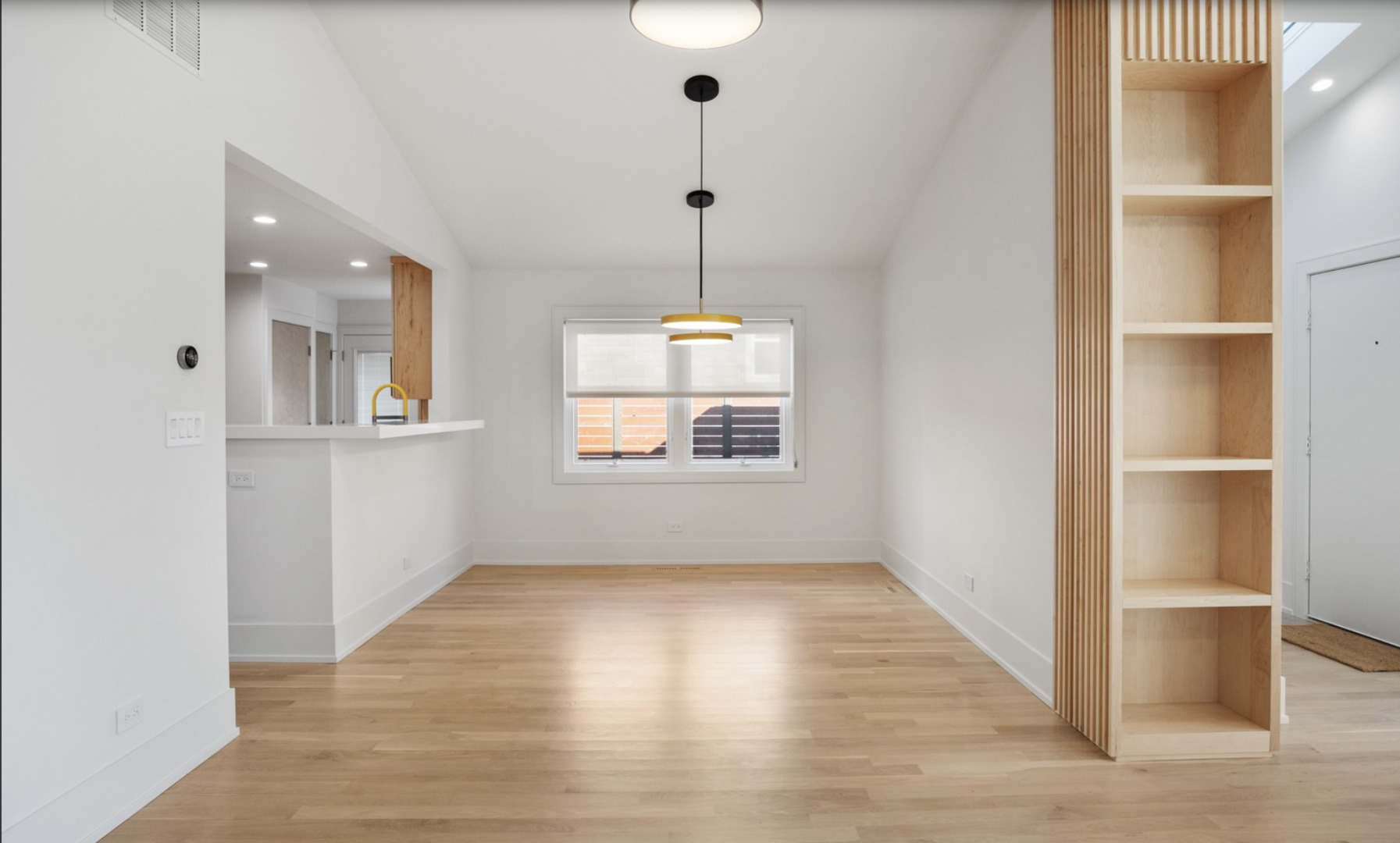 548 Exmoor Road Kenilworth, IL 60043 - Photo 6 of 19 a view of an empty room with wooden floor and a window