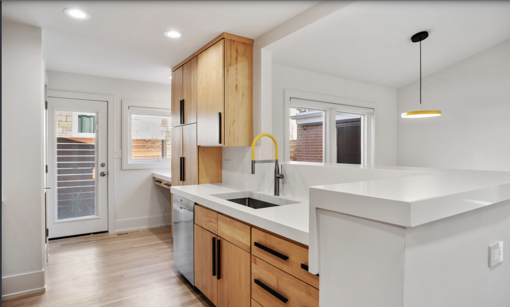 548 Exmoor Road Kenilworth, IL 60043 - Photo 7 of 19 a kitchen with stainless steel appliances a sink a stove a refrigerator and cabinets
