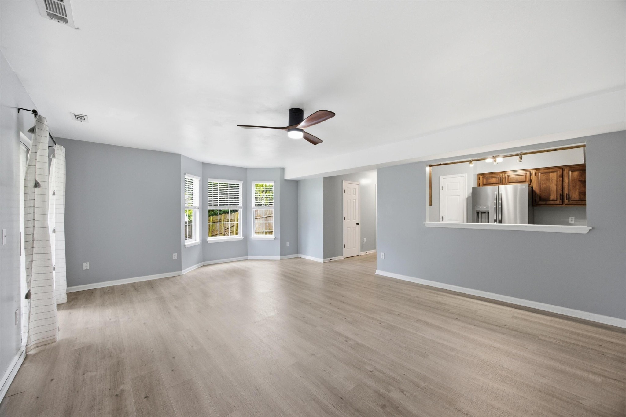 6729 Hickory Trace Circle Chattanooga, TN 37421 - Photo 6 of 30 a view of an empty room with wooden floor and a window