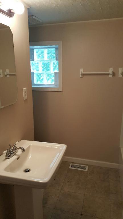 719 Highland Road Red Boiling Springs, TN 37150 - Photo 11 of 12 a bathroom with a sink and a window