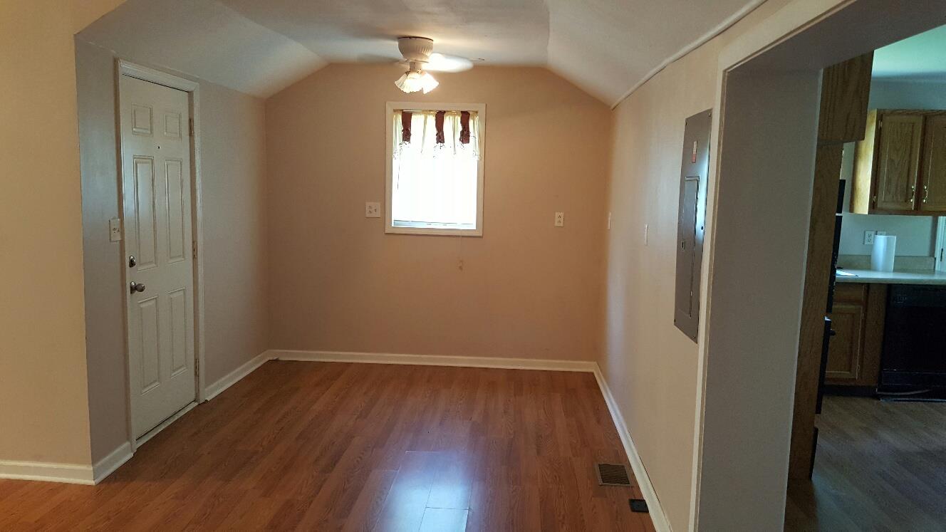 719 Highland Road Red Boiling Springs, TN 37150 - Photo 7 of 12 wooden floor in an empty room with a window