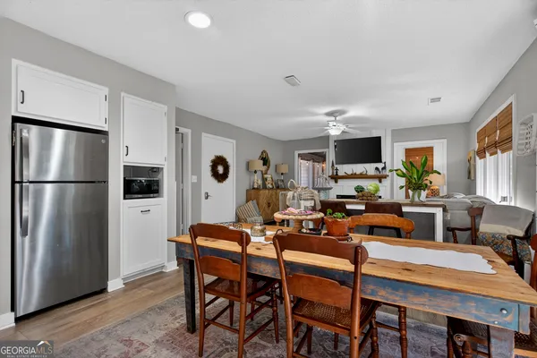 a very nice looking dining room with a table and chairs