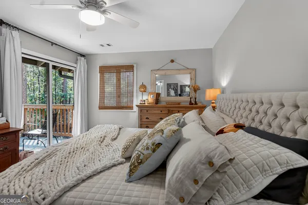 a bedroom with bed and window