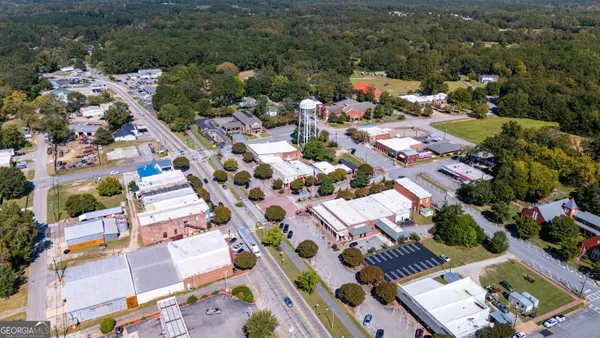 a view of a backyard with trees