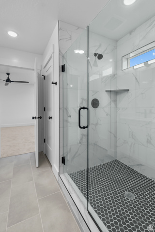 1213 West 500 South Logan, UT 84321 - Photo 15 of 29 Glass-enclosed shower with black hexagon floor tiling and white marble-look wall tiling