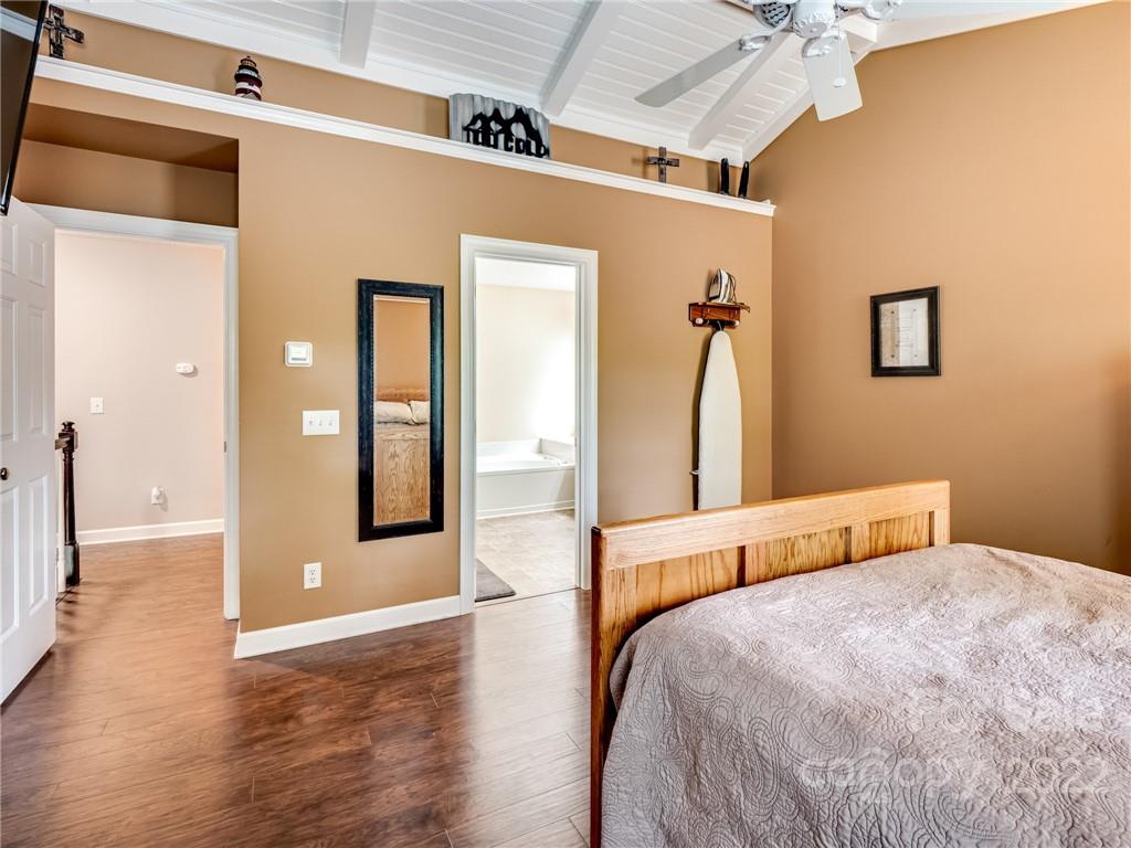 1663 Heather Glen Road Kannapolis, NC 28081 - Photo 20 of 30 a bedroom with a bed and wooden floor