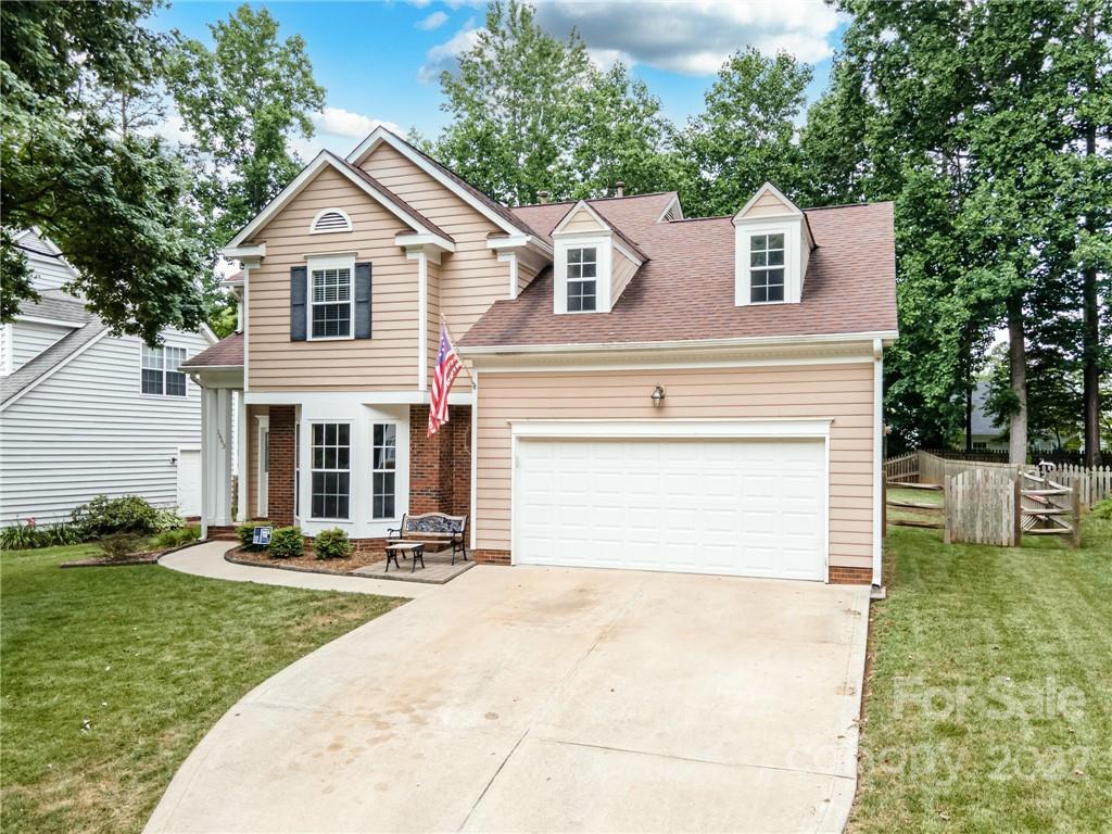 1663 Heather Glen Road Kannapolis, NC 28081 - Photo 2 of 30 a front view of a house with a yard