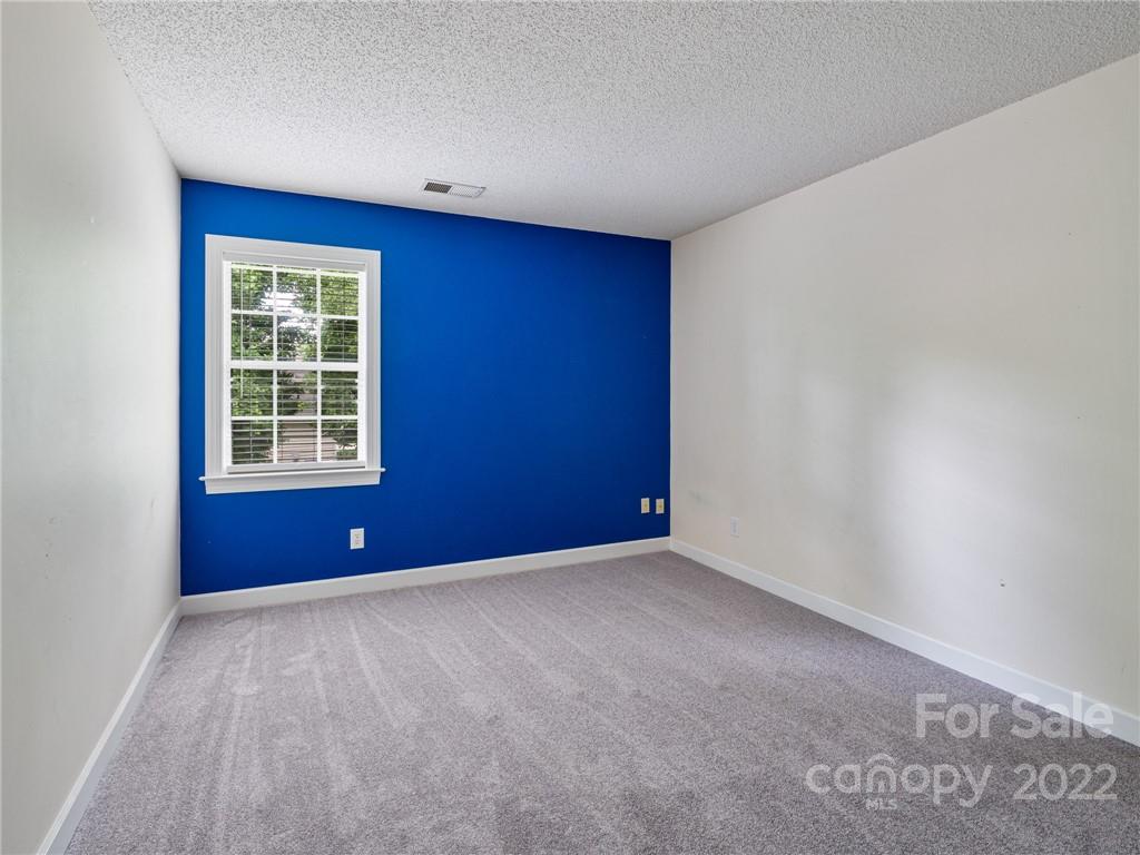 1663 Heather Glen Road Kannapolis, NC 28081 - Photo 25 of 30 a view of an empty room with a window