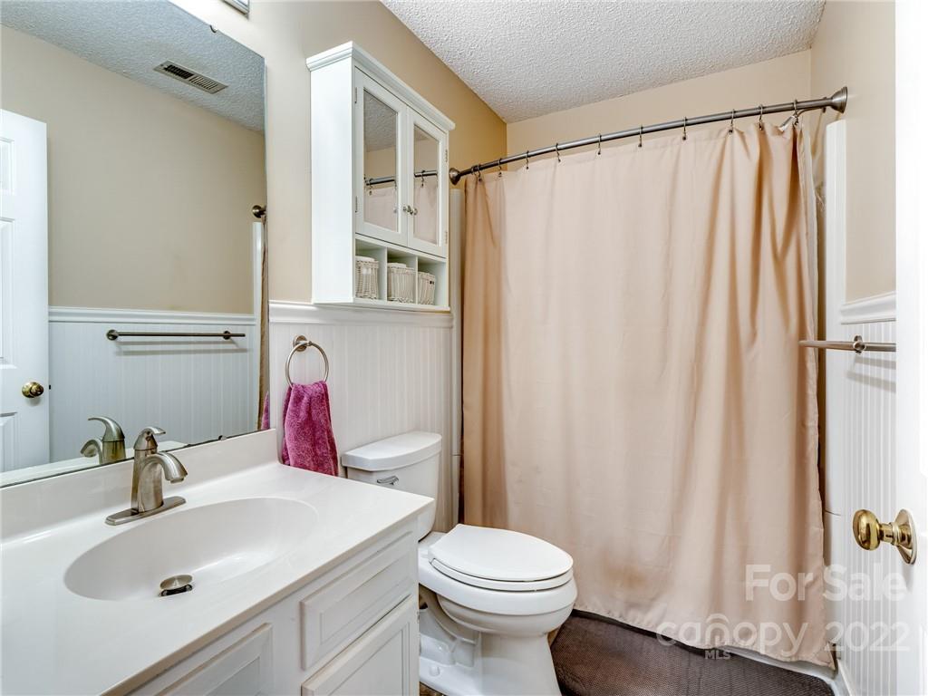 1663 Heather Glen Road Kannapolis, NC 28081 - Photo 27 of 30 a bathroom with a sink and a mirror