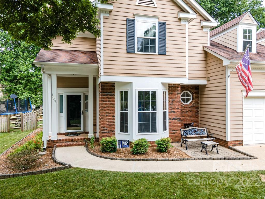 1663 Heather Glen Road Kannapolis, NC 28081 - Photo 3 of 30 a front view of a house with garden