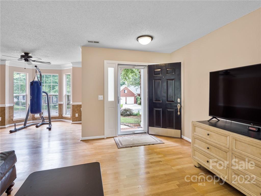 1663 Heather Glen Road Kannapolis, NC 28081 - Photo 4 of 30 a living room with furniture and flat screen tv