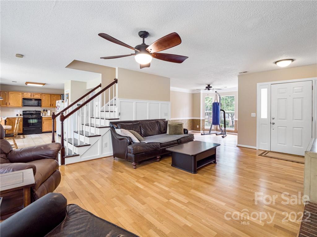 1663 Heather Glen Road Kannapolis, NC 28081 - Photo 8 of 30 a living room with furniture and a wooden floor