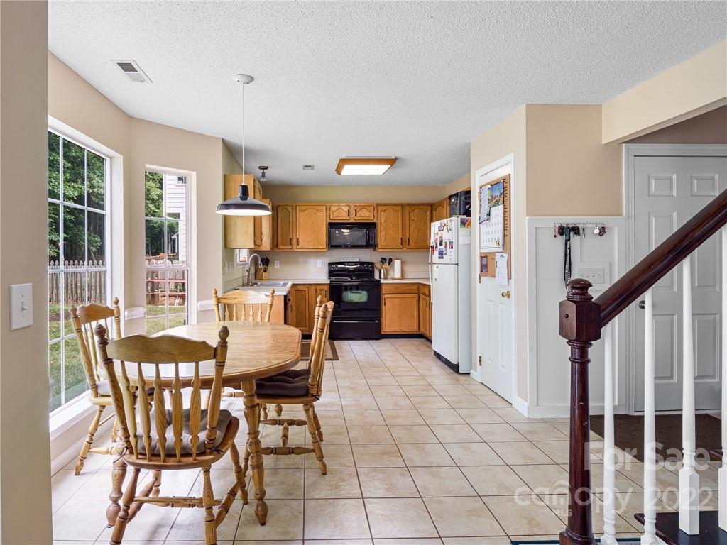 1663 Heather Glen Road Kannapolis, NC 28081 - Photo 10 of 30 a view of a dining room with furniture