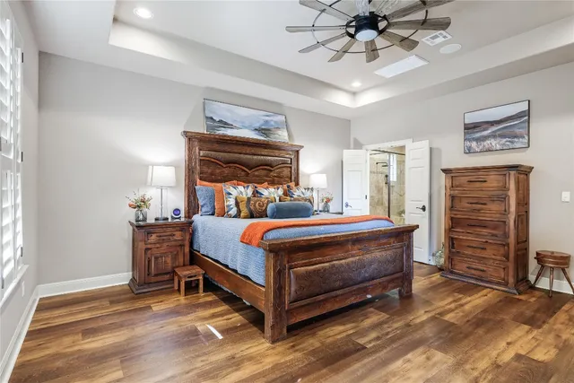 a bed room with a bed and a chandelier