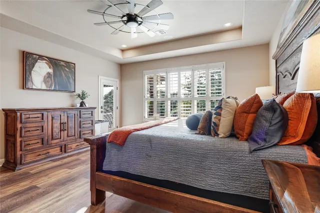 a bedroom with furniture and wooden floor