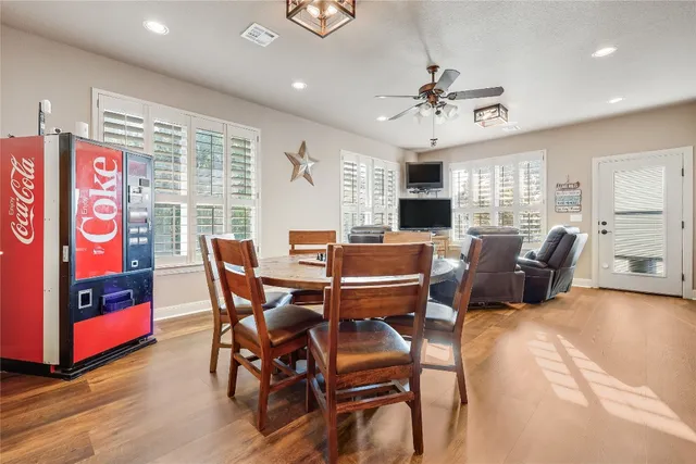 a view of a dining room with furniture window and wooden floor