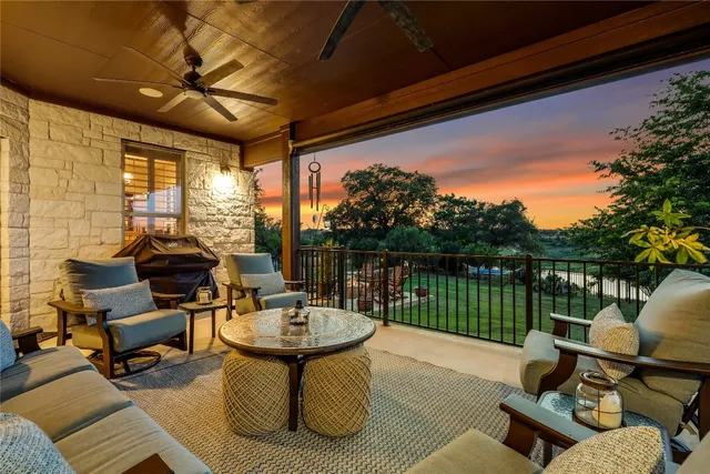 a view of a house with backyard sitting area and garden