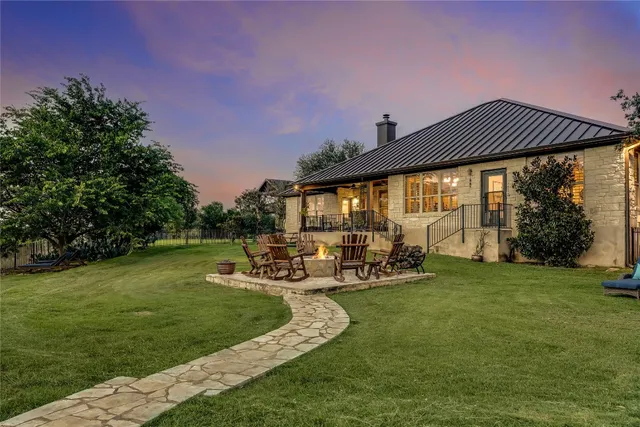 a view of a tree in the middle of a yard
