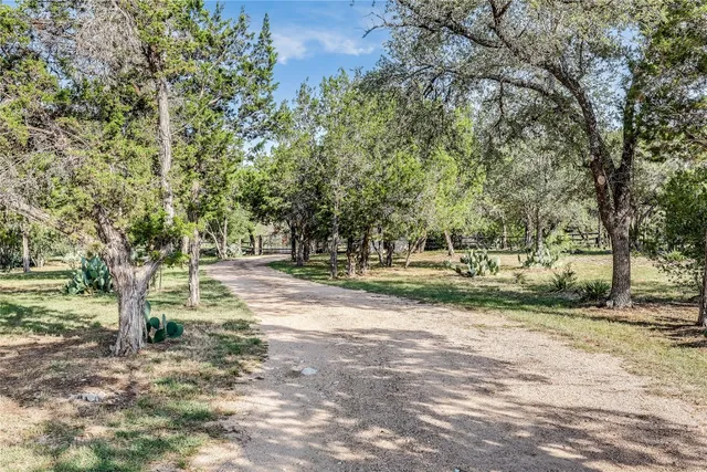 an aerial view of lake and residential houses with outdoor space
