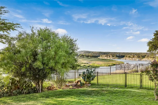 a view of a chairs and table in the garden