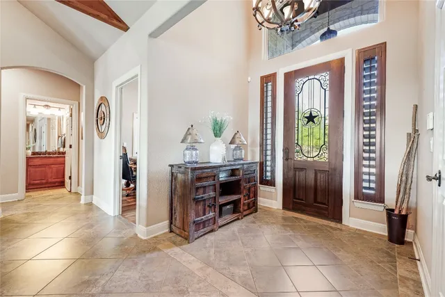 a view of a hallway view with furniture and a livingroom
