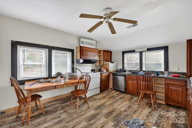 a work room with furniture and windows