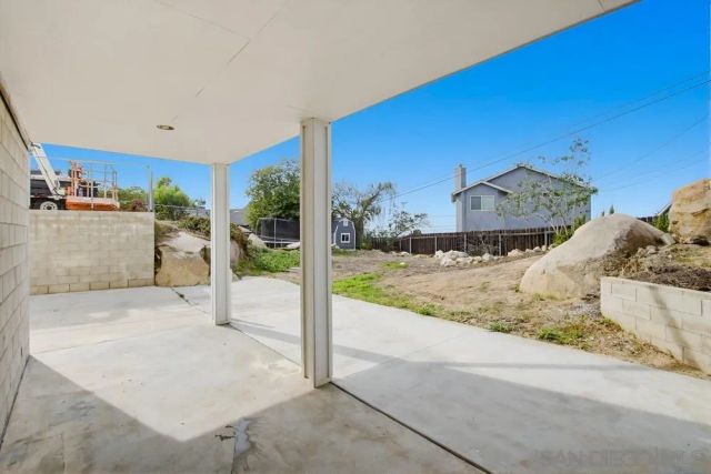 a view of a living room and a large window
