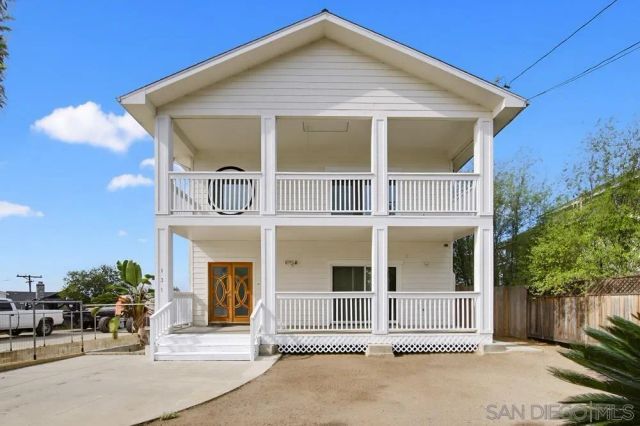 a front view of a house with a porch