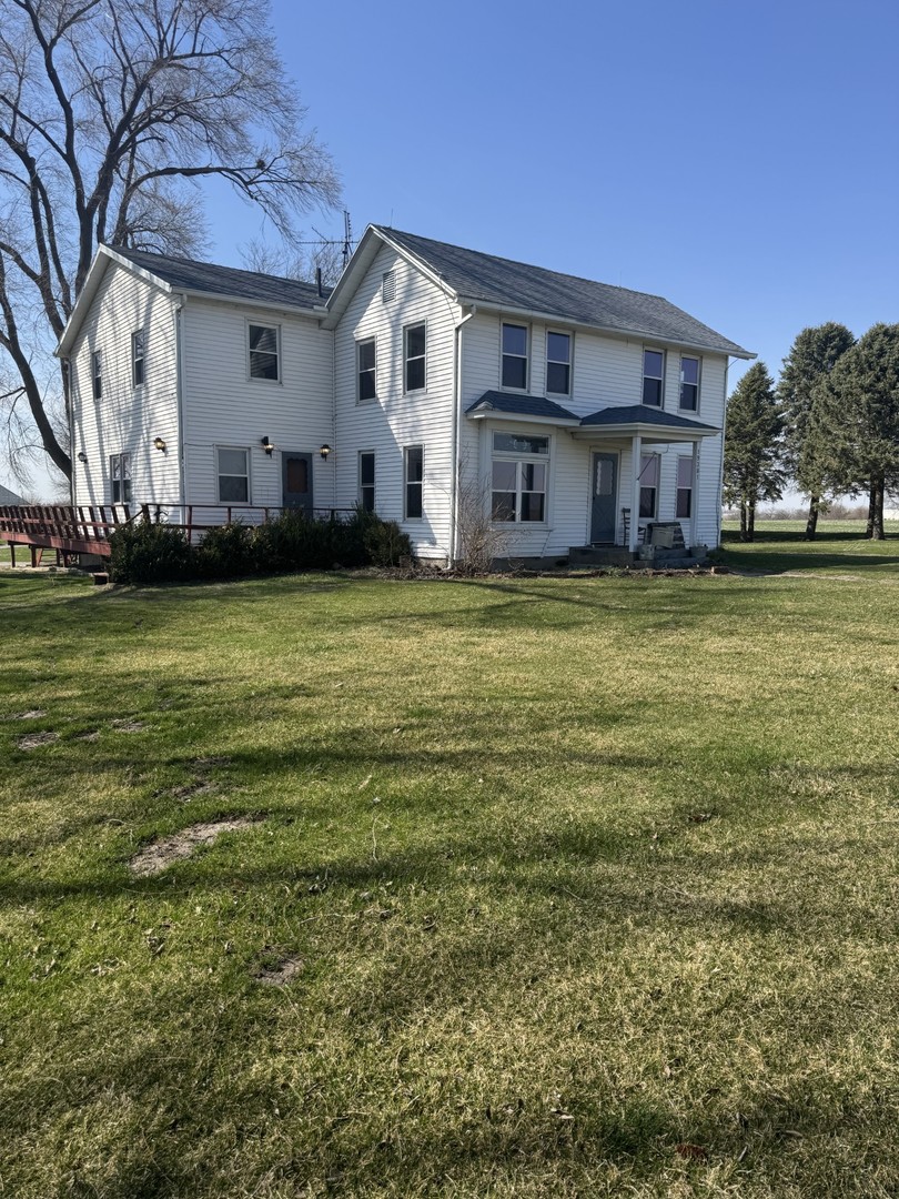 19381 Luther Road Sterling, IL 61081 - Photo 11 of 43 a view of a house with a big yard and large trees