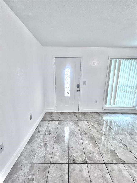 3409 Vorden Street New Port Richey, FL 34655 - Photo 11 of 41 a view of an empty room and window