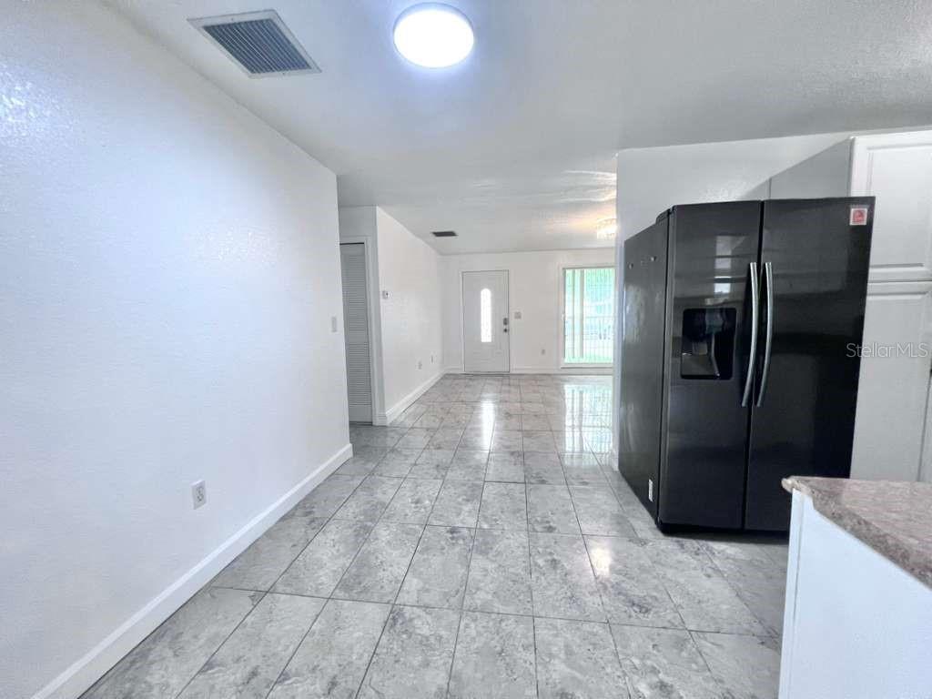 3409 Vorden Street New Port Richey, FL 34655 - Photo 15 of 41 a view of a refrigerator in kitchen and a counter top space