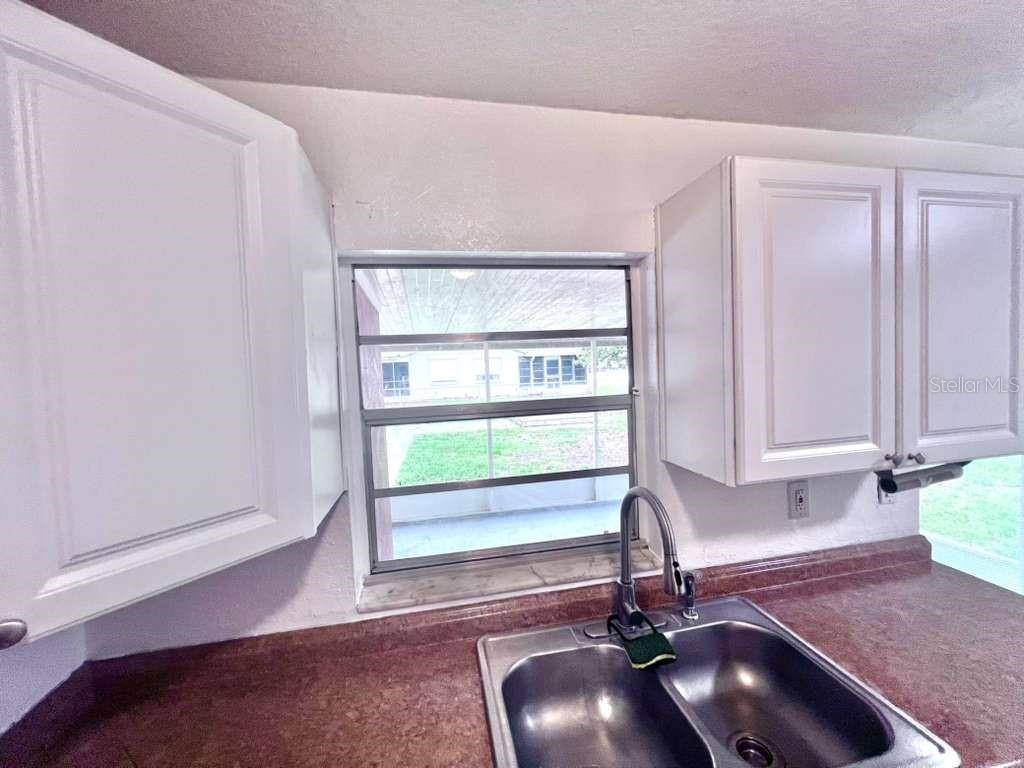 3409 Vorden Street New Port Richey, FL 34655 - Photo 18 of 41 a room with furniture and a window