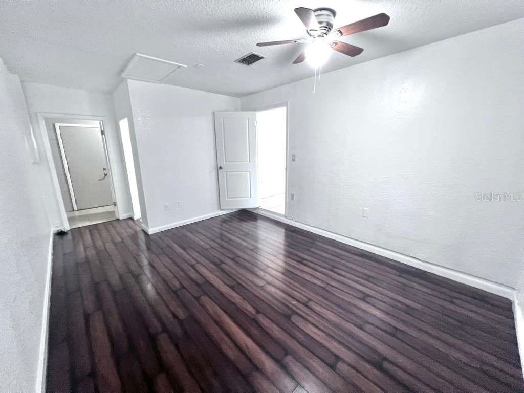 3409 Vorden Street New Port Richey, FL 34655 - Photo 21 of 41 wooden floor in an empty room with a window