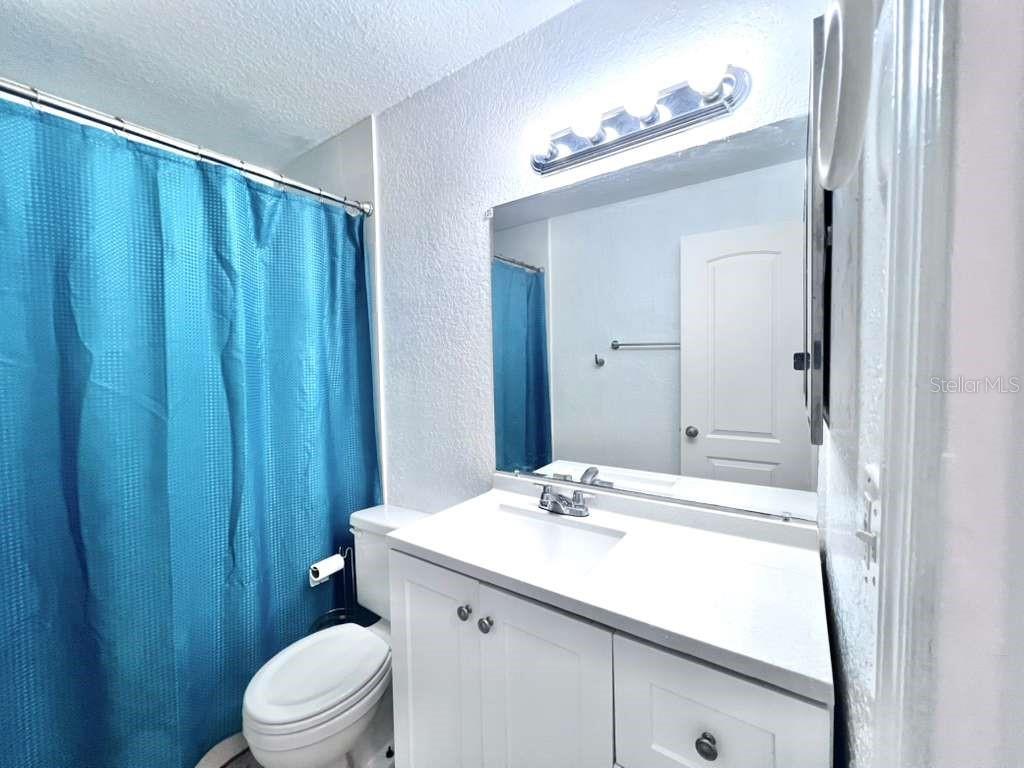 3409 Vorden Street New Port Richey, FL 34655 - Photo 25 of 41 a bathroom with a sink a toilet and shower