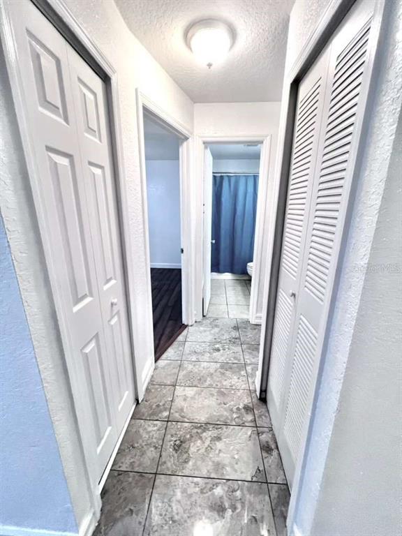 3409 Vorden Street New Port Richey, FL 34655 - Photo 29 of 41 a view of a hallway with wooden floor and staircase