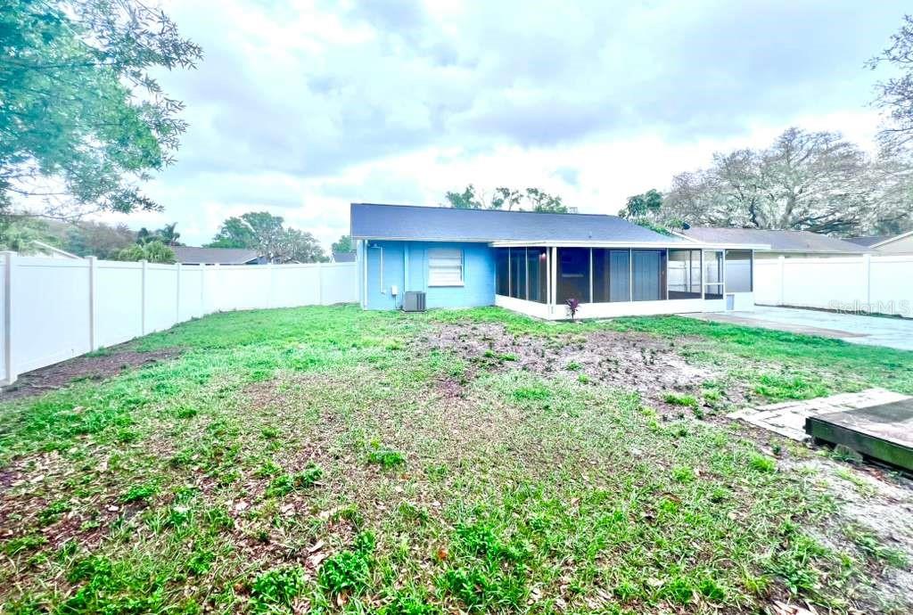 3409 Vorden Street New Port Richey, FL 34655 - Photo 6 of 41 a view of a house with yard and a garden