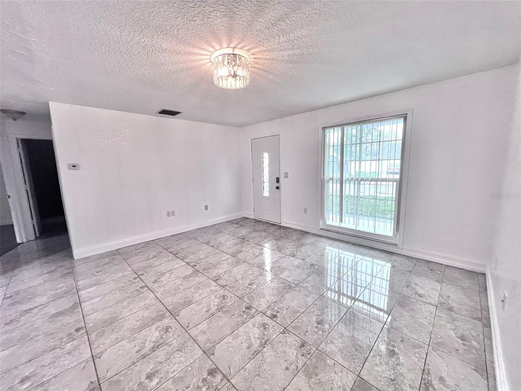 3409 Vorden Street New Port Richey, FL 34655 - Photo 10 of 41 a view of an empty room with a window