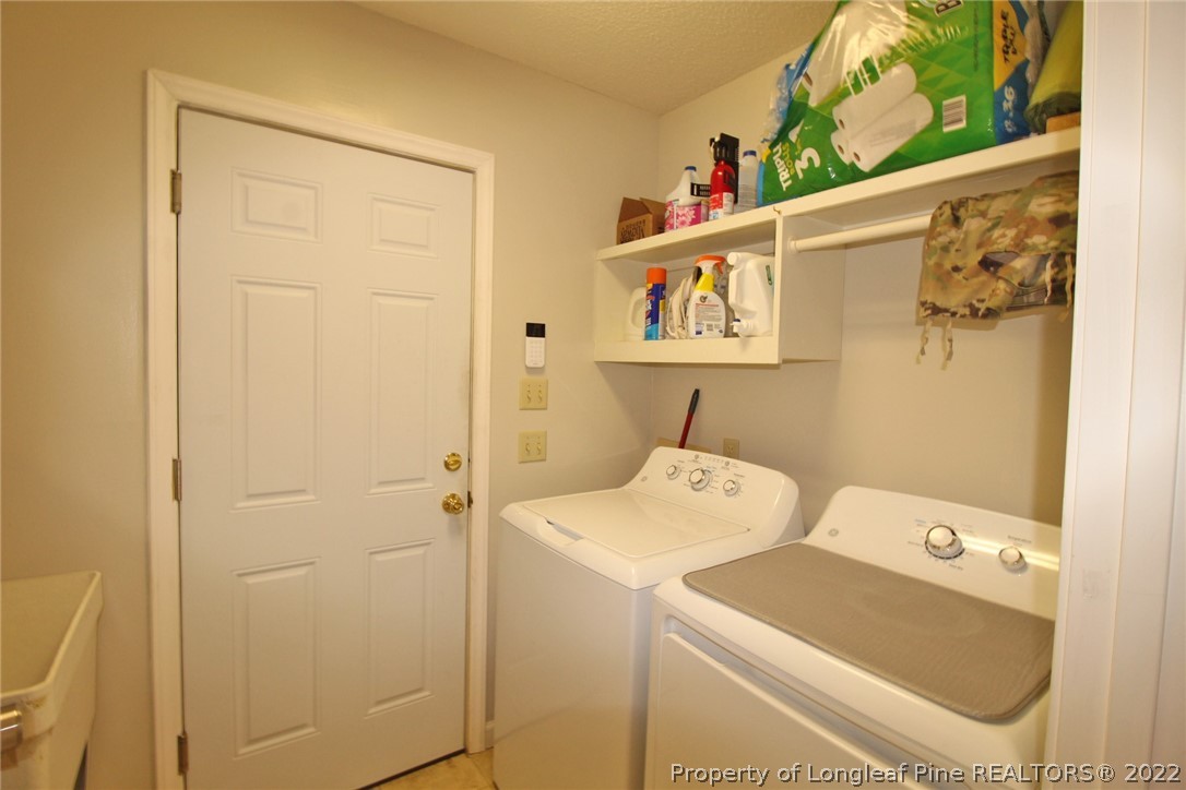 679 Cedar Point Vass, NC 28394 - Photo 13 of 18 a utility room with dryer and washer