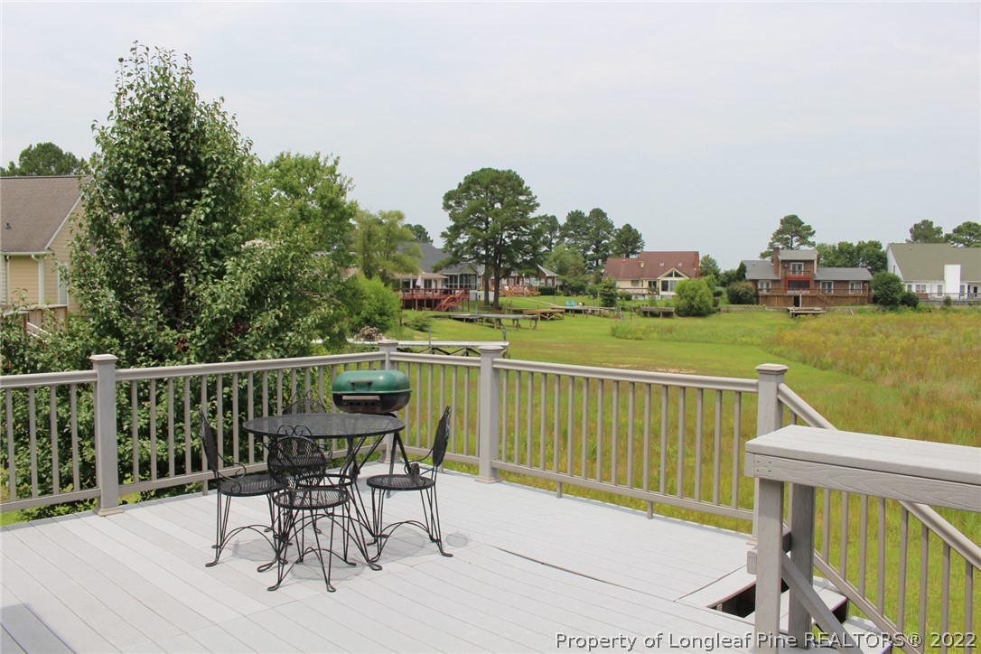 679 Cedar Point Vass, NC 28394 - Photo 16 of 18 a view of a chairs and table on the deck