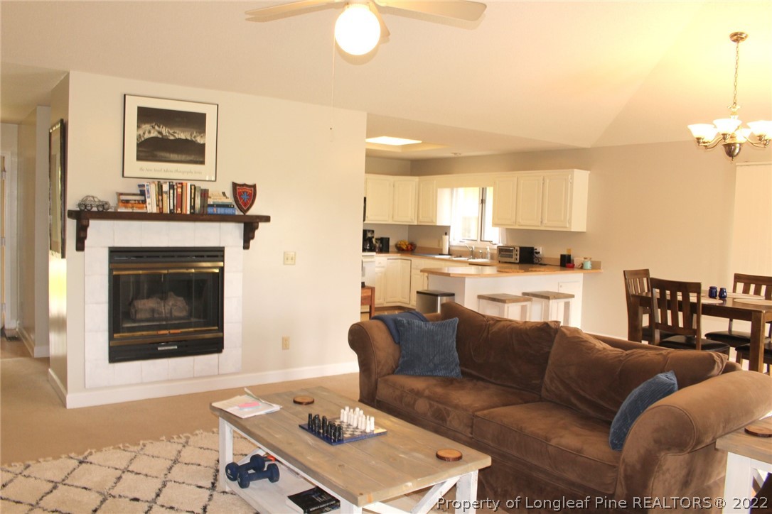 679 Cedar Point Vass, NC 28394 - Photo 6 of 18 a living room with furniture and a fireplace