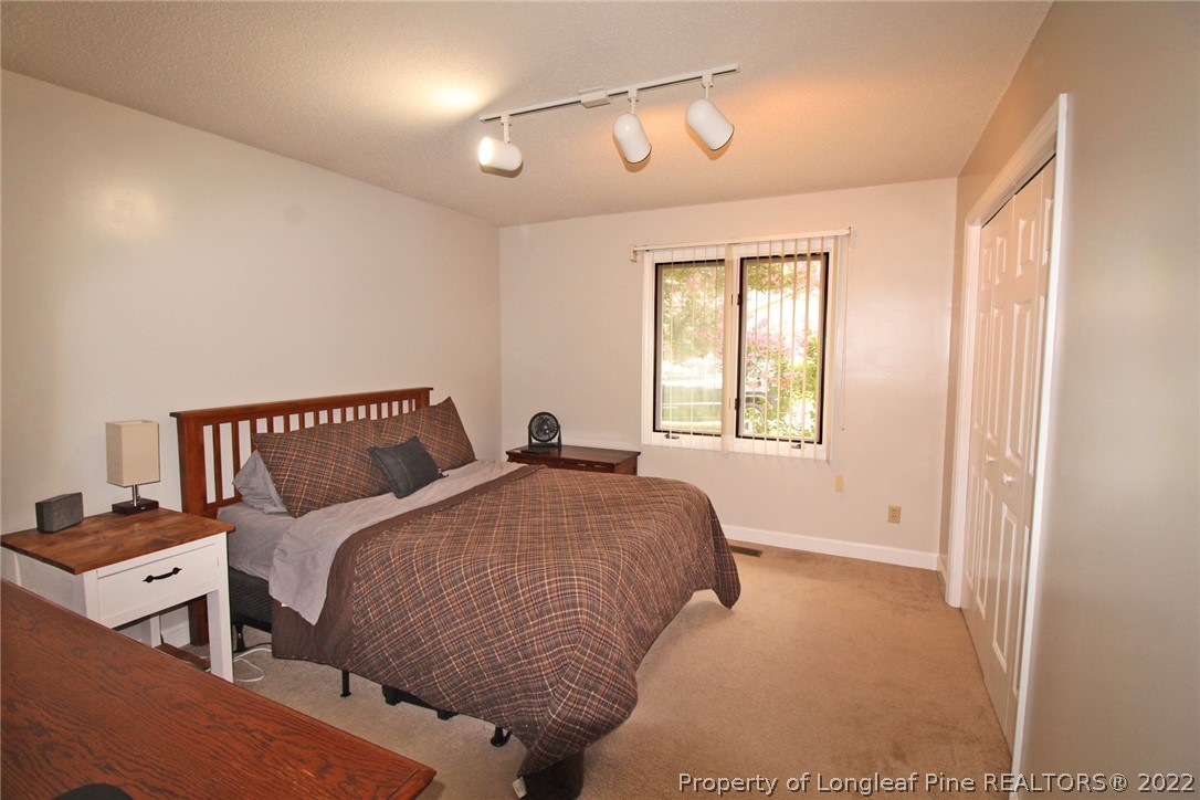 679 Cedar Point Vass, NC 28394 - Photo 10 of 18 a bedroom with a bed and a window