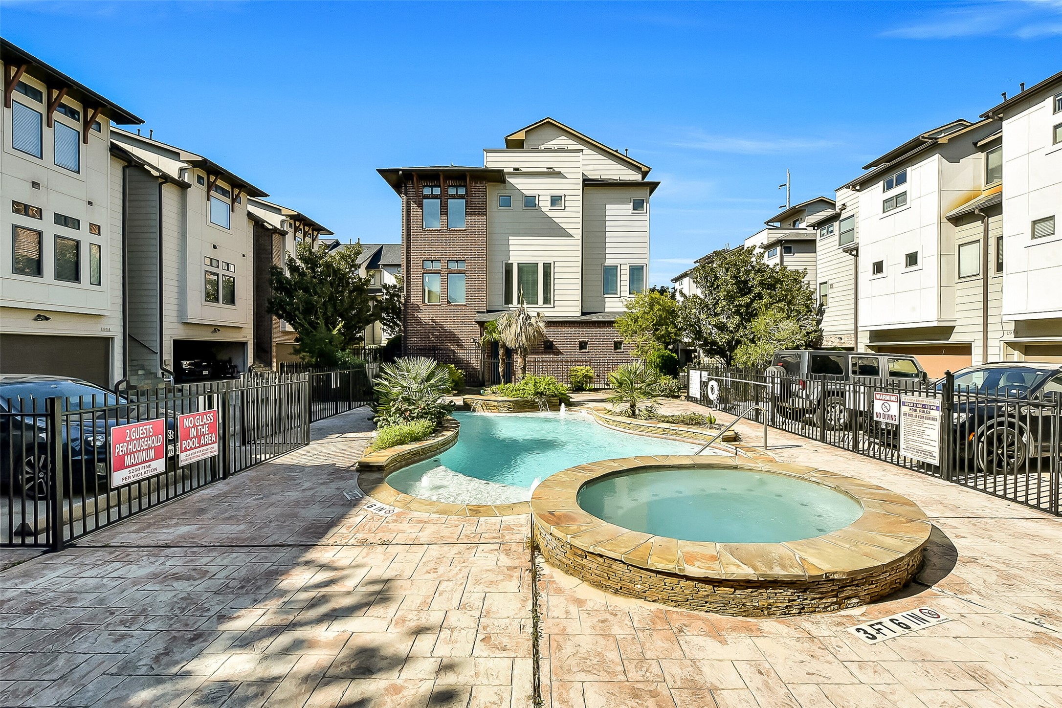 1929 Summer Street Houston, TX 77007 - Photo 3 of 27 Resort-style community amenities include a pool and hot tub within the gated community (VERY rare for this neighborhood!). Annual HOA fee includes water, trash, controlled access, landscaping, and pool maintenance. The HOA replaced the community entrance gates and all iron railing in 2025. Notice the unit is situated adjacent to the pool area!