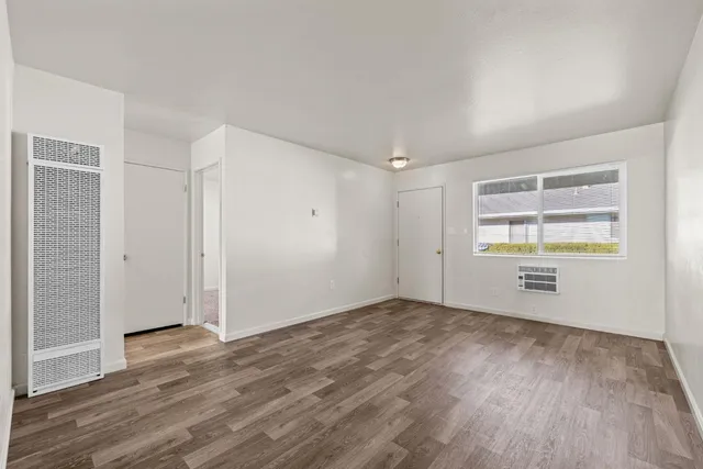 a kitchen with a refrigerator and a stove