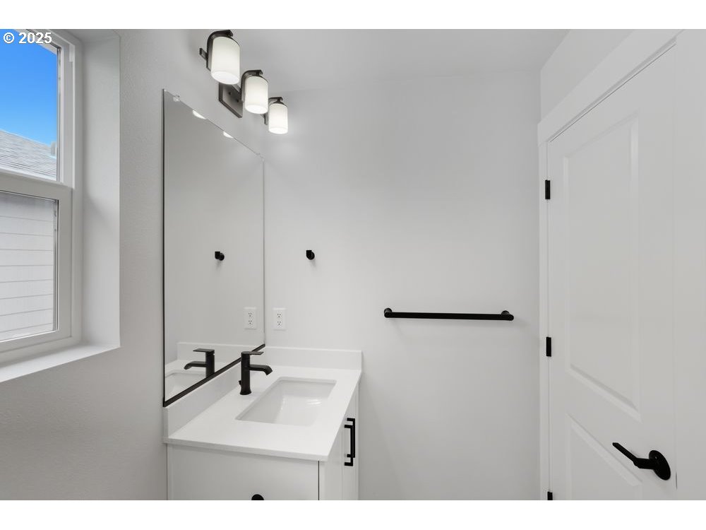 3736 Southwest 38th Street Gresham, OR 97080 - Photo 13 of 15 a bathroom with a sink vanity and mirror
