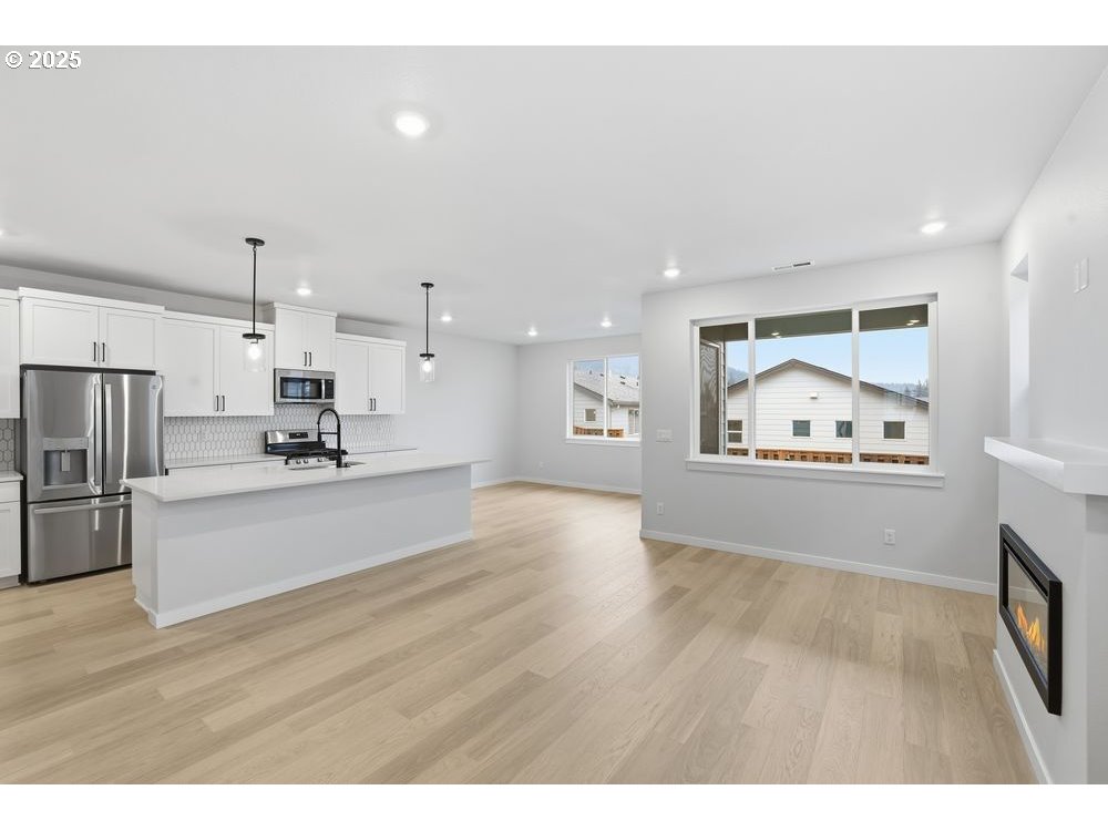 3736 Southwest 38th Street Gresham, OR 97080 - Photo 4 of 15 a view of kitchen with cabinets and wooden floor