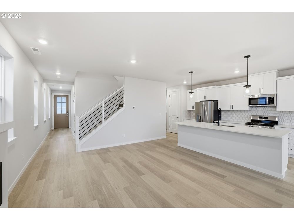 3736 Southwest 38th Street Gresham, OR 97080 - Photo 5 of 15 a view of empty room with wooden floor