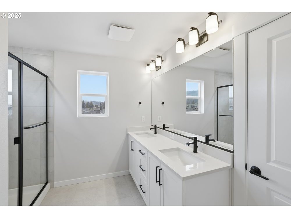 3736 Southwest 38th Street Gresham, OR 97080 - Photo 10 of 15 a bathroom with a sink a mirror and a shower